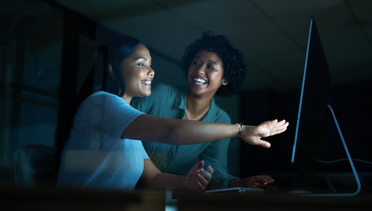 Two business owners working together on a computer