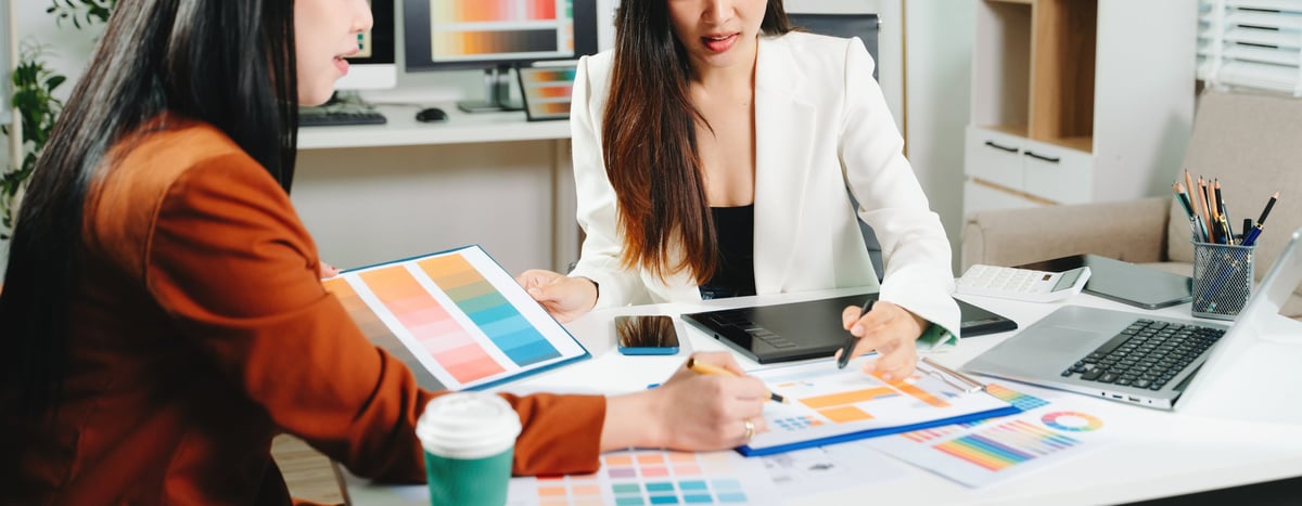 Designers collaborating on a colour palette and interface layout