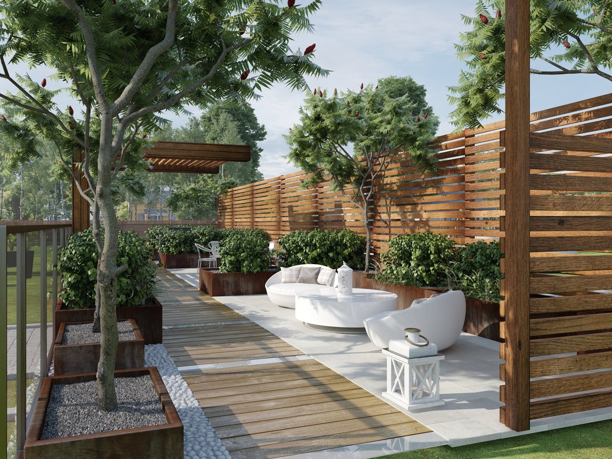 Modern outdoor patio with wooden decking, slatted privacy fences, corten steel planters, and white lounge furniture